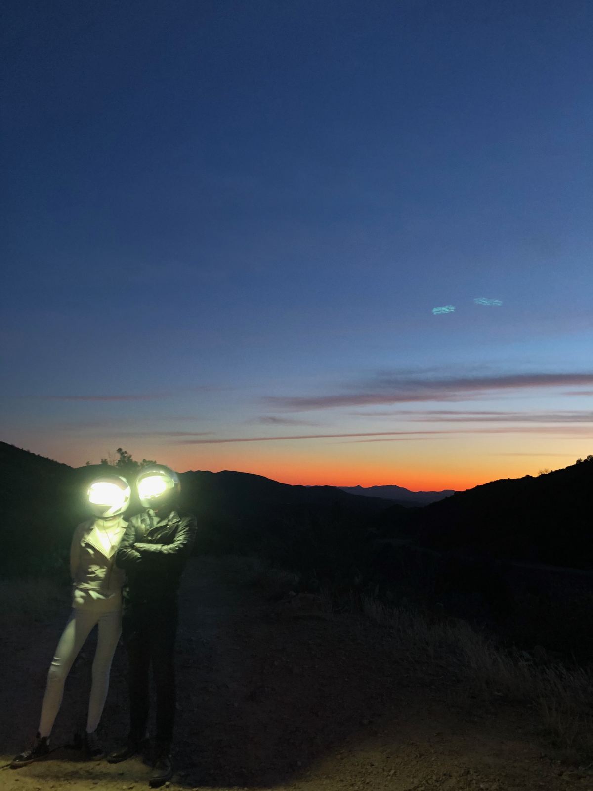 Brock Monroe, "Alien" — Director of Photography (drone) and camera operator. Behind the scenes on location at twilight: figures lit against the sky, hills beyond.