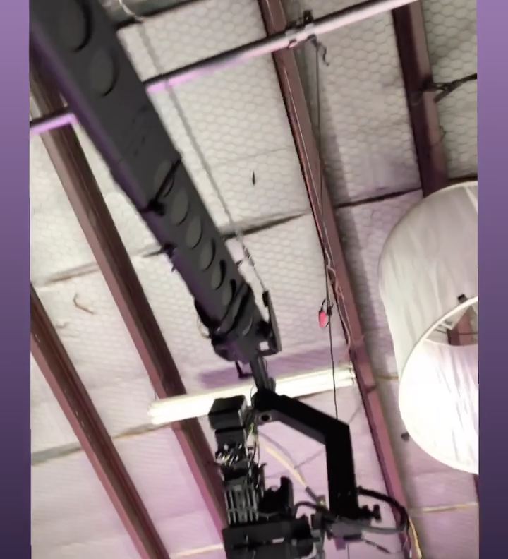 Simply Three, "September" — behind the scenes. The black Jib and its camera head rigged under the studio ceiling, its lamp and diffuser around it.