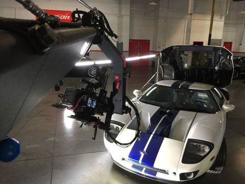 Jib — filming a car inside a garage.