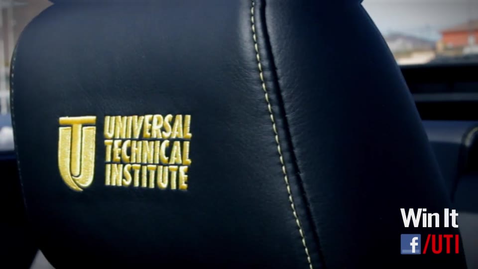 Universal Technical Institute — Jib. A car seat back in close-up, its gold embroidered UTI mark, with the promotion's own Win It graphic and Facebook link burned into the corner of the frame.