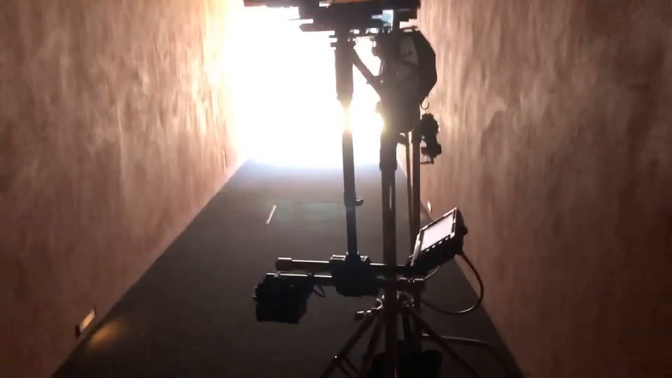 Jesus Is King (2019) — Steadicam operator (short), behind the scenes. The Steadicam rig on the walkway between takes, the set lit at the far end.